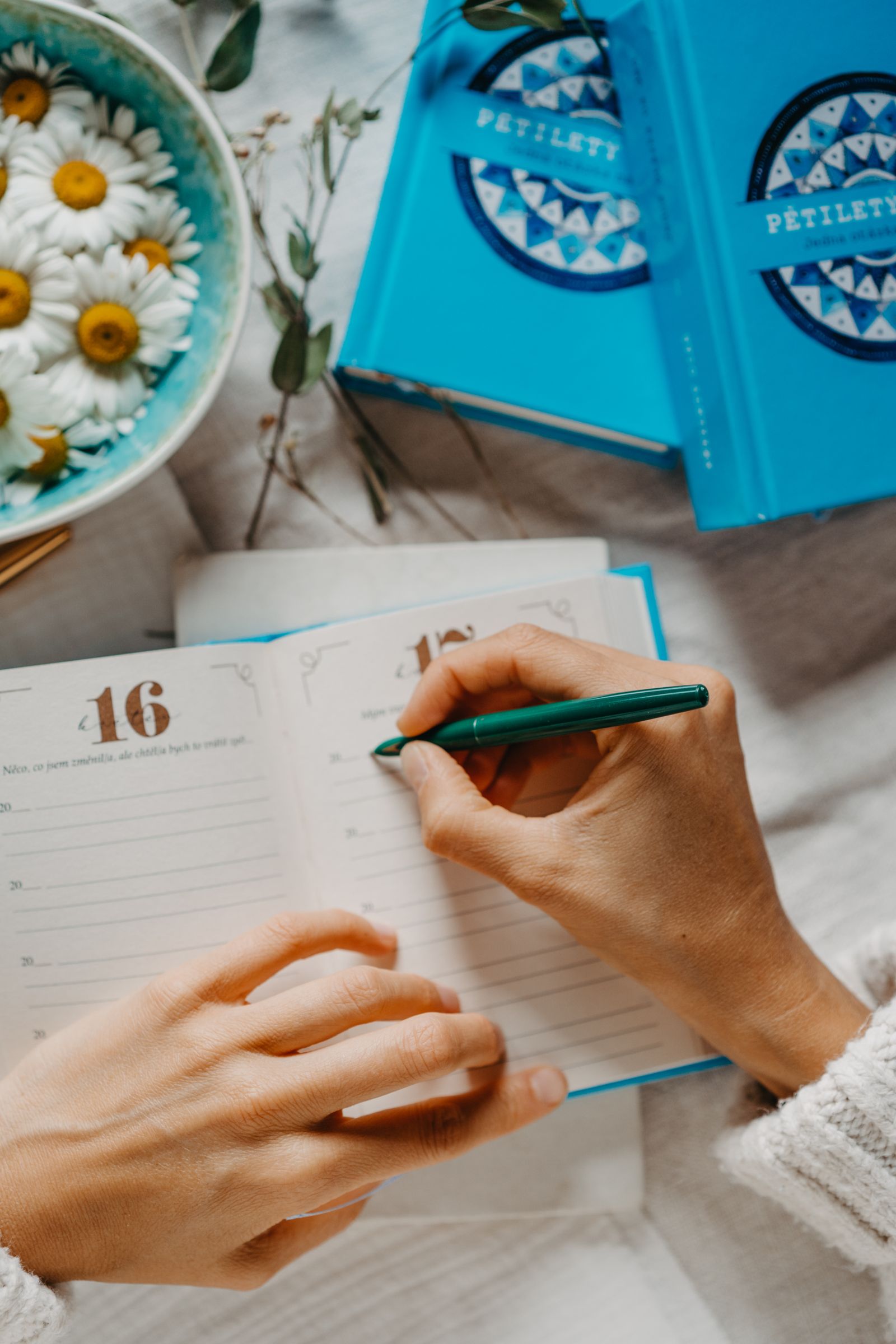 A woman writing in her journal during a quiet devotional moment
